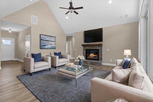 21 Old, American, Pendleton, SC 29670 - living area featuring high vaulted ceiling, light wood-style floors, a fireplace, ceiling fan, and baseboards