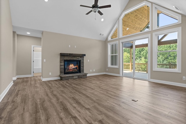 21 Old, American, Pendleton, SC 29670 - unfurnished living room featuring high vaulted ceiling, a ceiling fan, a stone fireplace, wood finished floors, and baseboards