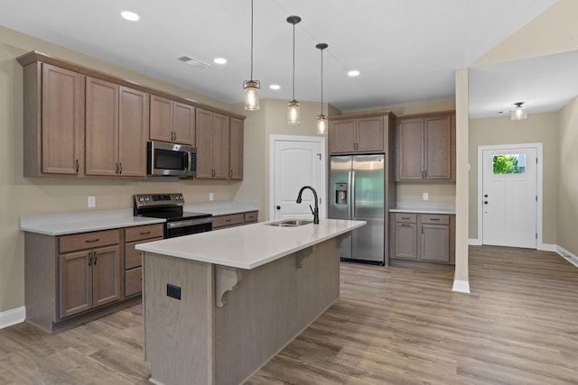 21 Old, American, Pendleton, SC 29670 - kitchen featuring appliances with stainless steel finishes, a sink, baseboards, light wood finished floors, and pendant lighting
