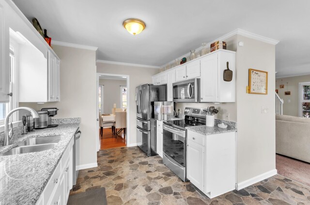 106 Rockport, Pacolet, SC 29372 - kitchen featuring appliances with stainless steel finishes, stone finish flooring, healthy amount of natural light, and crown molding