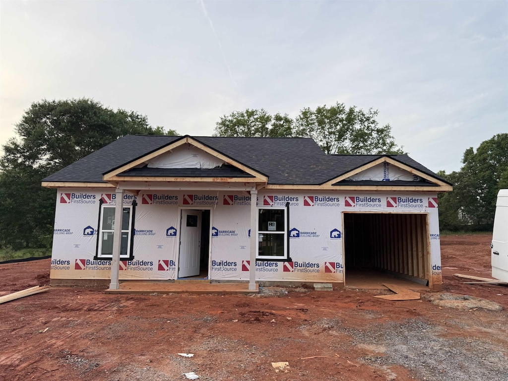 241 Woodgate, Cowpens, SC 29330 - property under construction featuring a garage, roof with shingles, and driveway