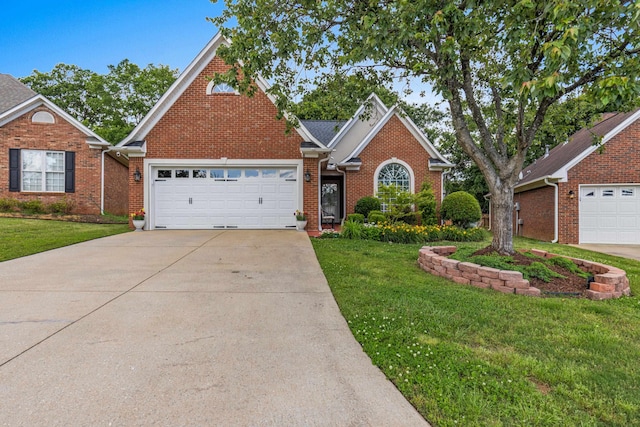 413 Rambling Rose, Moore, SC 29369 - traditional-style house featuring a front yard, driveway, brick siding, and a garage