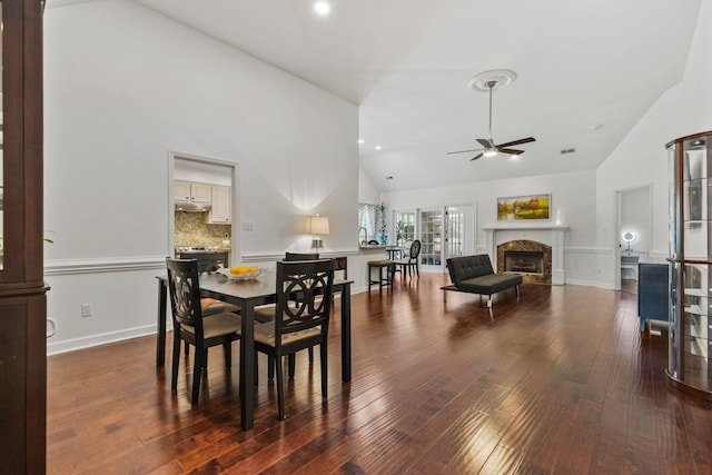 413 Rambling Rose, Moore, SC 29369 - dining area with ceiling fan, high vaulted ceiling, a fireplace, hardwood / wood-style flooring, and baseboards
