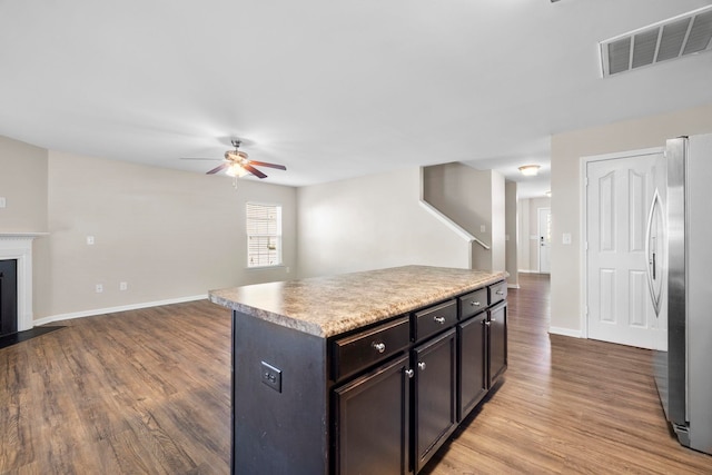 325 Victory, Moore, SC 29369 - kitchen with freestanding refrigerator, ceiling fan, open floor plan, and light wood-style flooring