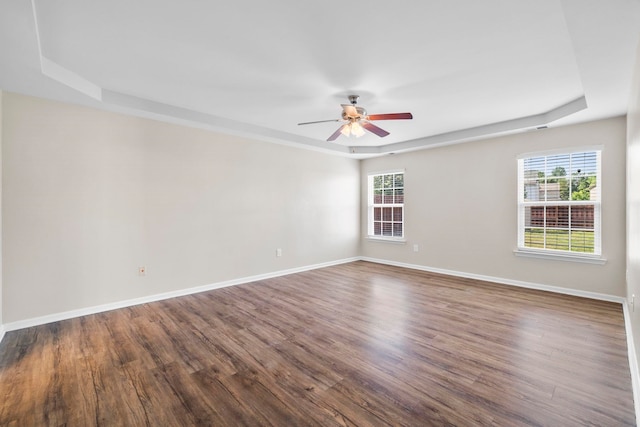 325 Victory, Moore, SC 29369 - empty room featuring a ceiling fan, plenty of natural light, wood finished floors, and a raised ceiling