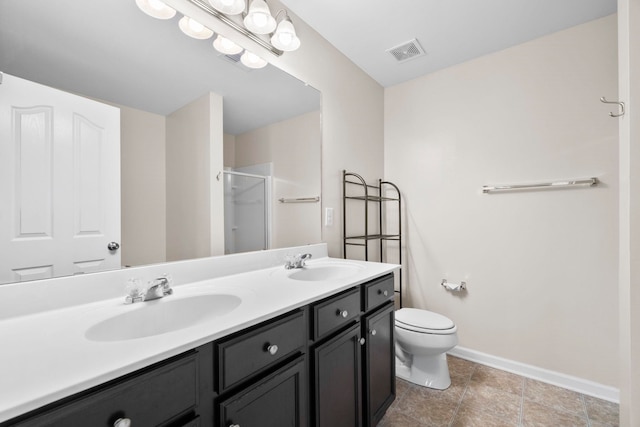 325 Victory, Moore, SC 29369 - bathroom featuring baseboards, a stall shower, double vanity, and toilet