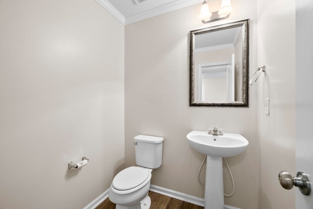 325 Victory, Moore, SC 29369 - bathroom featuring crown molding, toilet, wood finished floors, baseboards, and a sink