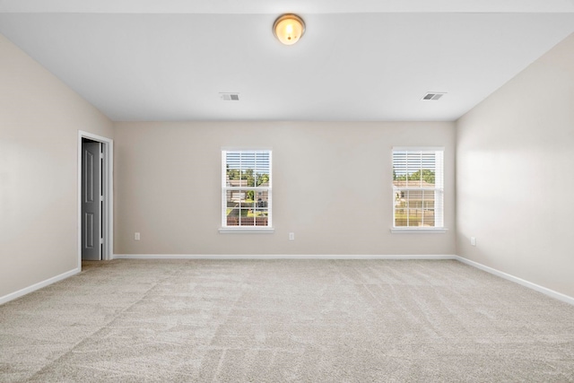325 Victory, Moore, SC 29369 - unfurnished room with plenty of natural light, light carpet, baseboards, and vaulted ceiling