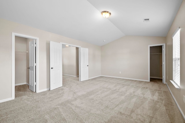 325 Victory, Moore, SC 29369 - unfurnished bedroom with a spacious closet, a closet, vaulted ceiling, carpet, and multiple windows