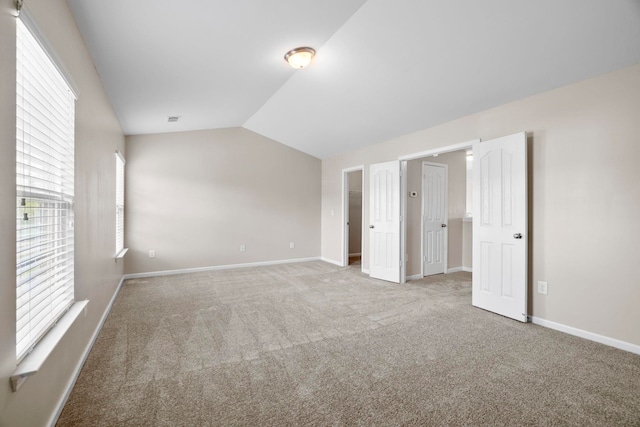 325 Victory, Moore, SC 29369 - unfurnished bedroom featuring multiple windows, carpet flooring, lofted ceiling, and baseboards