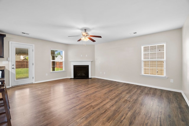 325 Victory, Moore, SC 29369 - unfurnished living room with ceiling fan, dark wood-style floors, a fireplace with flush hearth, and baseboards