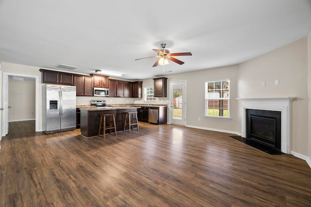 325 Victory, Moore, SC 29369 - kitchen featuring appliances with stainless steel finishes, a center island, dark brown cabinets, a ceiling fan, and dark wood-style floors