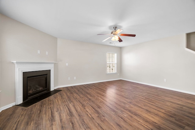 325 Victory, Moore, SC 29369 - unfurnished living room with a ceiling fan, dark wood finished floors, a fireplace with flush hearth, and baseboards