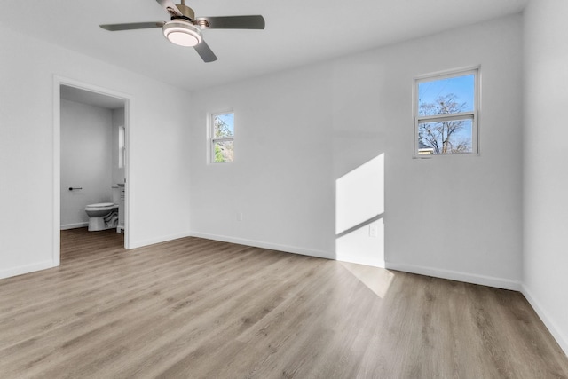 514 N Forest, Spartanburg, SC 29303 - unfurnished bedroom with wood finished floors, baseboards, ensuite bathroom, and ceiling fan