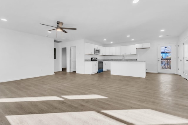 514 N Forest, Spartanburg, SC 29303 - unfurnished living room with recessed lighting, ceiling fan, wood finished floors, baseboards, and electric panel