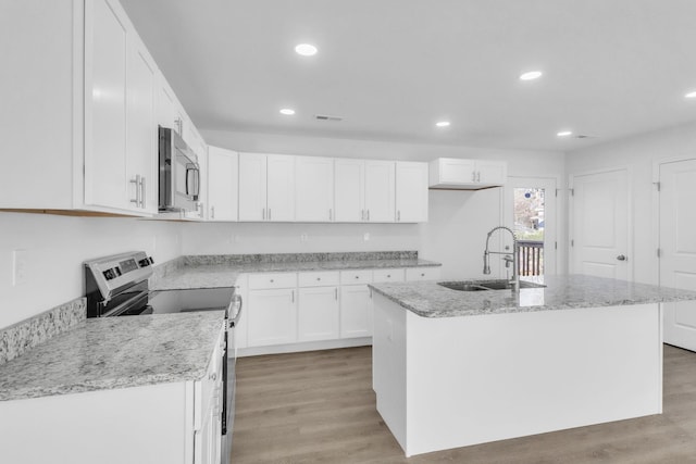 514 N Forest, Spartanburg, SC 29303 - kitchen featuring a sink, appliances with stainless steel finishes, white cabinets, recessed lighting, and light wood-style floors