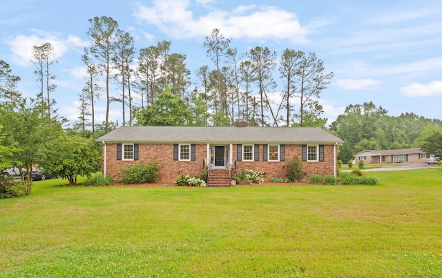 302 Peach Vly, Spartanburg, SC 29303 - ranch-style home with brick siding, a front yard, and a chimney