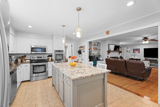 302 Peach Vly, Spartanburg, SC 29303 - kitchen featuring appliances with stainless steel finishes, light tile patterned flooring, a kitchen island, pendant lighting, and recessed lighting