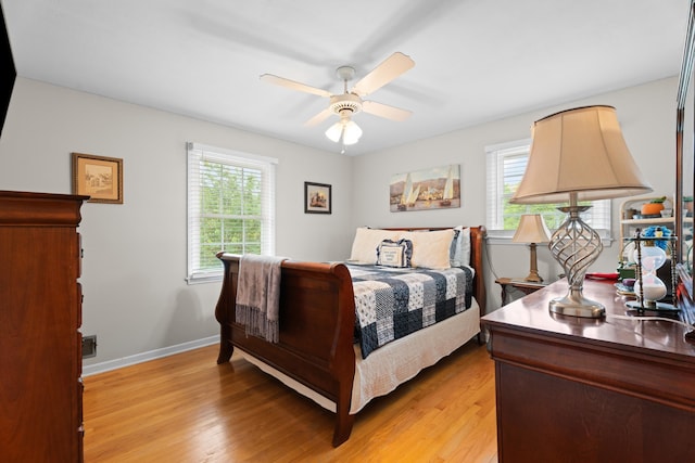 302 Peach Vly, Spartanburg, SC 29303 - bedroom with multiple windows, light wood-style floors, baseboards, and ceiling fan