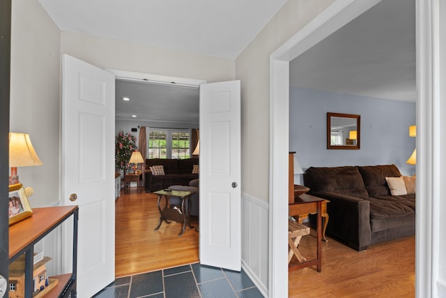 302 Peach Vly, Spartanburg, SC 29303 - foyer entrance featuring dark wood-style floors and a wainscoted wall