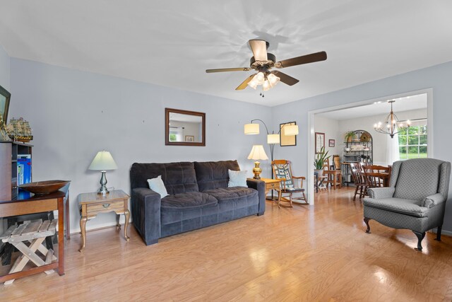 302 Peach Vly, Spartanburg, SC 29303 - living room with light wood-style floors, a chandelier, and a ceiling fan