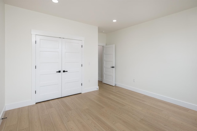 123 Stribling, Spartanburg, SC 29301 - unfurnished bedroom featuring light wood-style flooring, recessed lighting, baseboards, and a closet