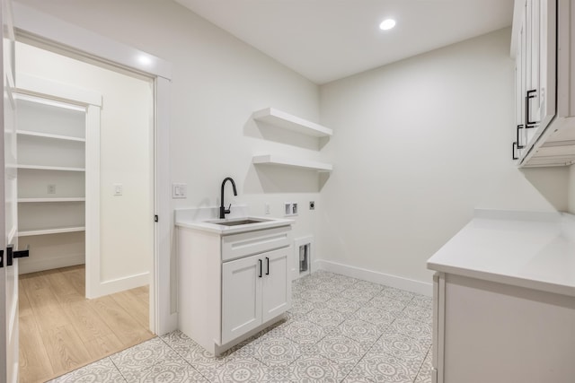 123 Stribling, Spartanburg, SC 29301 - laundry area featuring electric dryer hookup, washer hookup, cabinet space, baseboards, and recessed lighting
