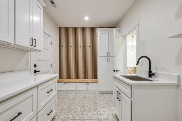 123 Stribling, Spartanburg, SC 29301 - kitchen with a sink, light countertops, white cabinets, recessed lighting, and light tile patterned floors