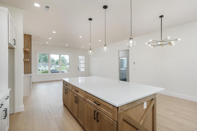 123 Stribling, Spartanburg, SC 29301 - kitchen with light wood finished floors, a center island, baseboards, light countertops, and recessed lighting