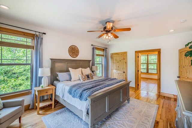 bedroom featuring light wood-style flooring, recessed lighting, and a ceiling fan