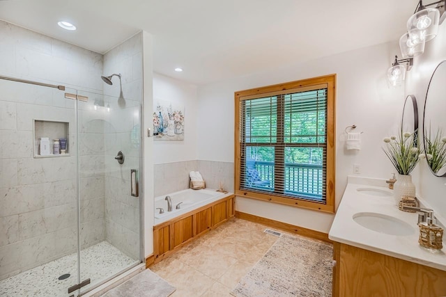 full bath with tile patterned floors, a shower stall, a bath, double vanity, and recessed lighting