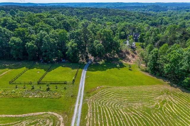 aerial view of sparsely populated area with a heavily wooded area