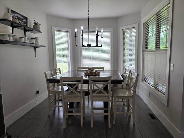 473 Meadow Rd, Inman, SC 29349 - dining space featuring a chandelier, healthy amount of natural light, baseboards, and dark wood-style flooring