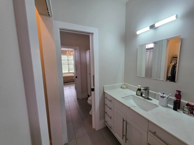 473 Meadow Rd, Inman, SC 29349 - bathroom with tile patterned floors, toilet, vanity, a towering ceiling, and a chandelier