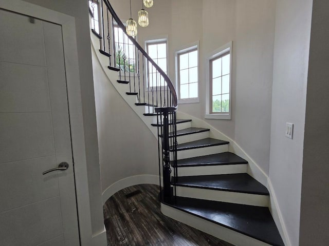473 Meadow Rd, Inman, SC 29349 - staircase featuring wood finished floors, baseboards, and a chandelier