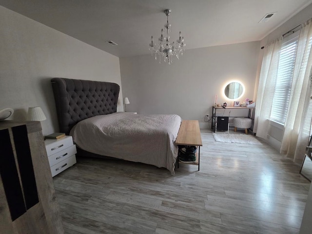 473 Meadow Rd, Inman, SC 29349 - bedroom featuring multiple windows, wood finished floors, and a chandelier