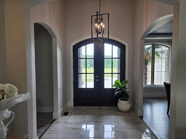 473 Meadow Rd, Inman, SC 29349 - foyer featuring french doors, arched walkways, a chandelier, and baseboards