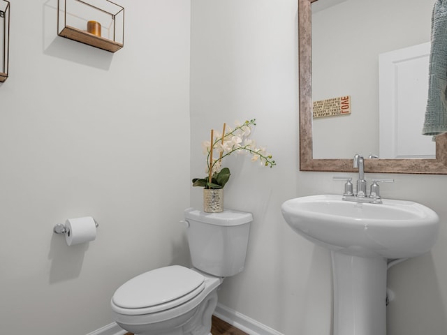 7007 Manse, Boiling Springs, SC 29316 - bathroom with toilet, baseboards, a sink, and wood finished floors