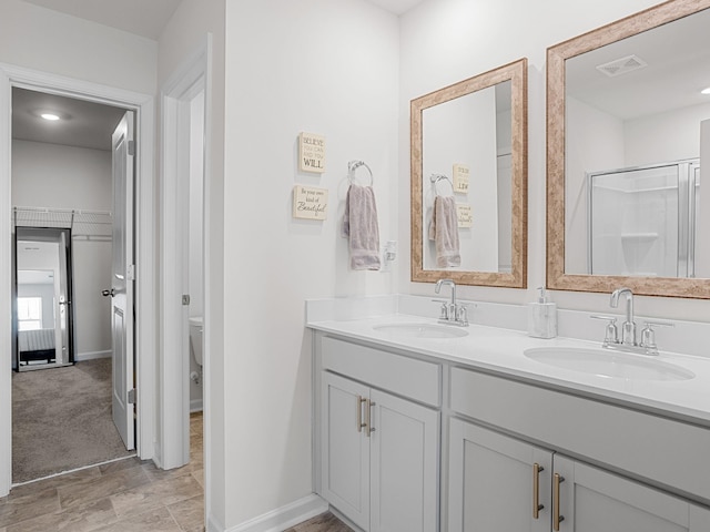 7007 Manse, Boiling Springs, SC 29316 - bathroom featuring double vanity, toilet, baseboards, and a shower