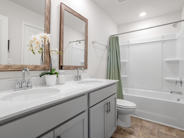 7007 Manse, Boiling Springs, SC 29316 - bathroom with shower / tub combo with curtain, double vanity, toilet, stone finish floors, and recessed lighting