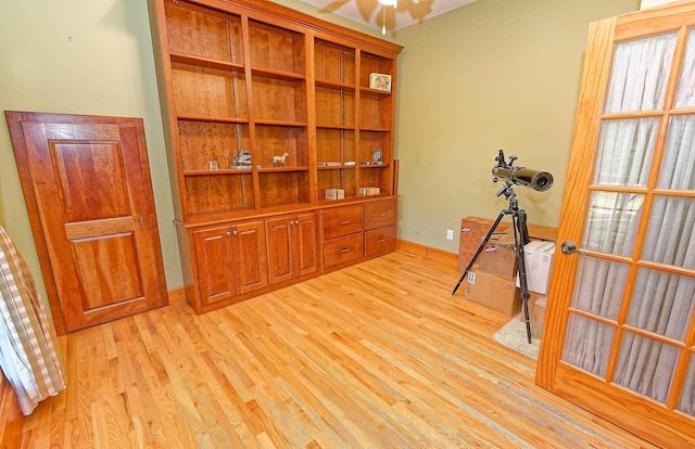 office area featuring light wood-style flooring and baseboards