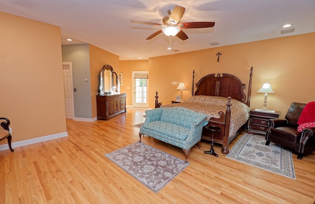 bedroom with light wood-type flooring, baseboards, and a ceiling fan
