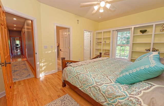 bedroom featuring light wood-type flooring and a ceiling fan