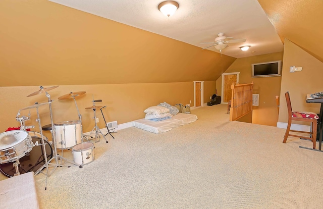 game room with lofted ceiling, carpet flooring, and a ceiling fan
