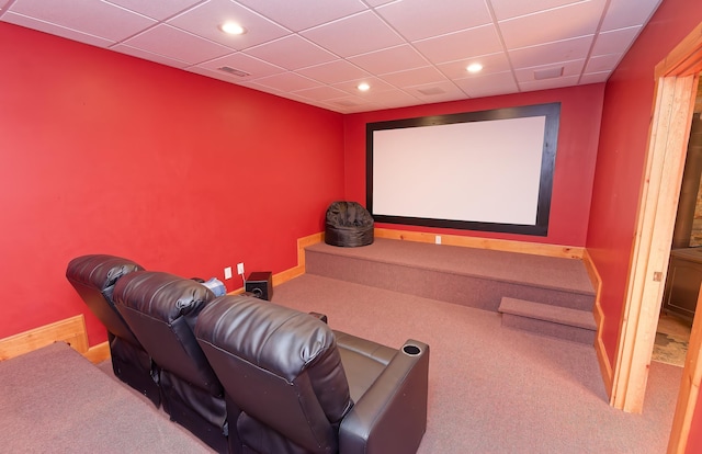 carpeted home theater room with recessed lighting and baseboards