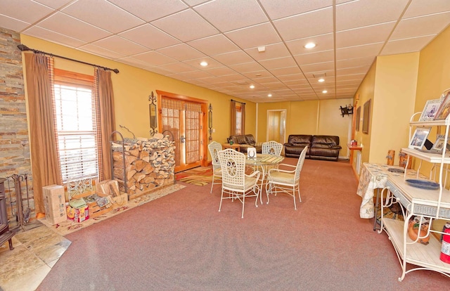 dining space with carpet floors, recessed lighting, and a paneled ceiling