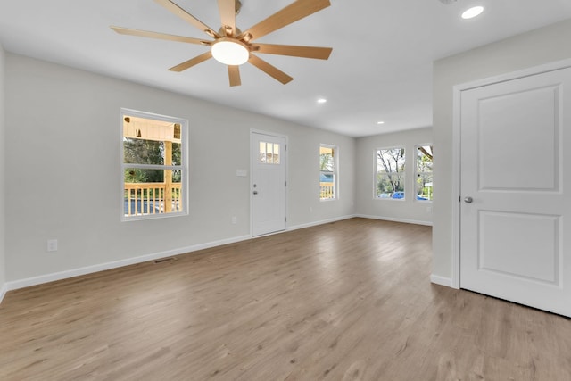 entrance foyer featuring light wood finished floors, a ceiling fan, baseboards, and recessed lighting