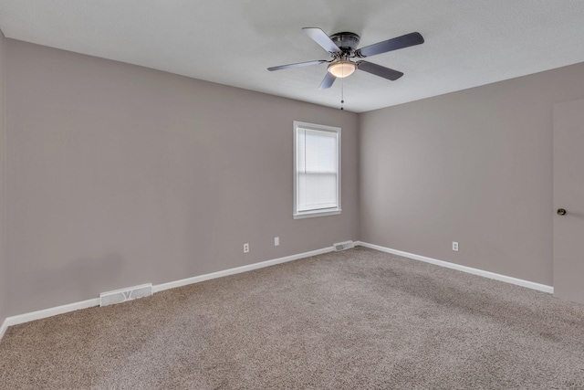 unfurnished room with ceiling fan, carpet floors, and baseboards
