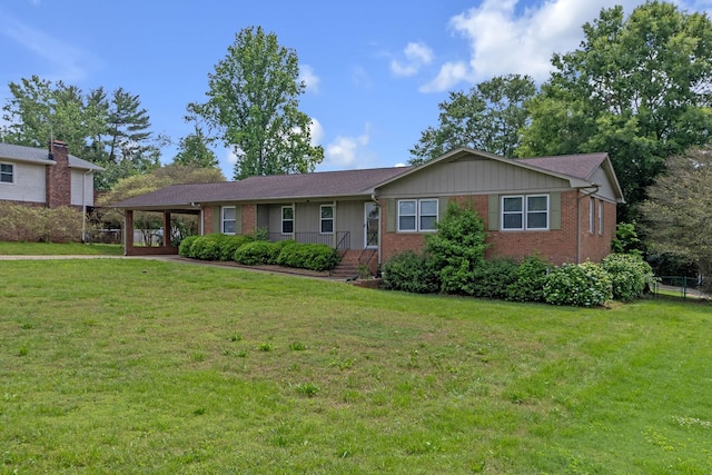 ranch-style house with brick siding, a carport, and board and batten siding