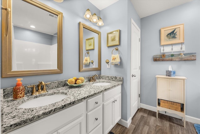 1101 Rosabella, Greer, SC 29651 - bathroom featuring wood finished floors, baseboards, and double vanity